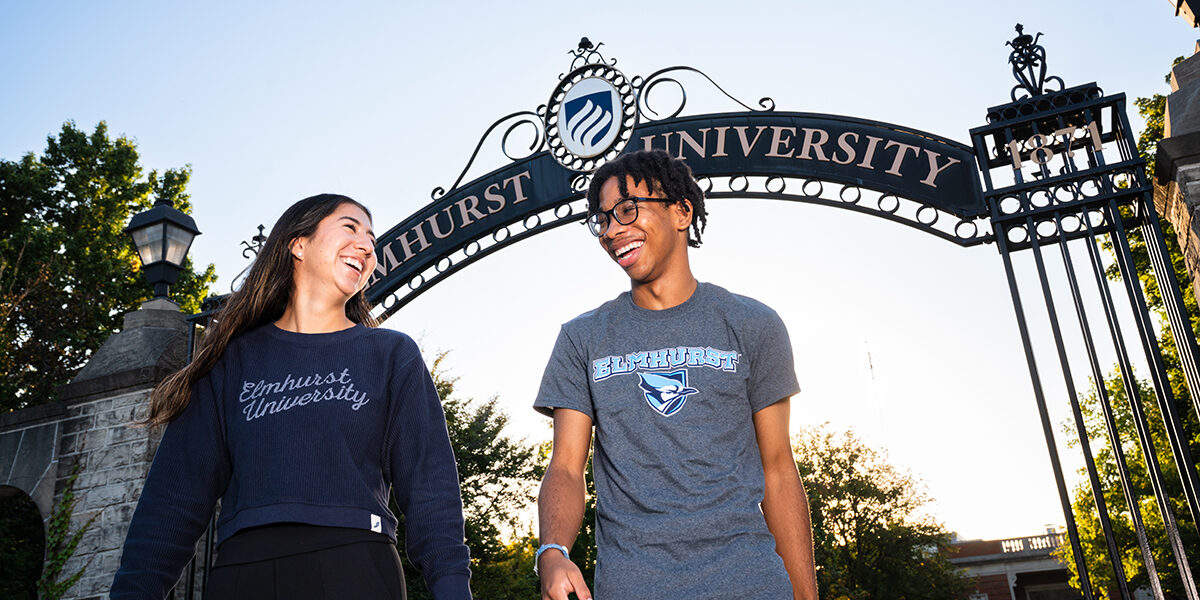 Students standing in front of the Gates of Knowledge