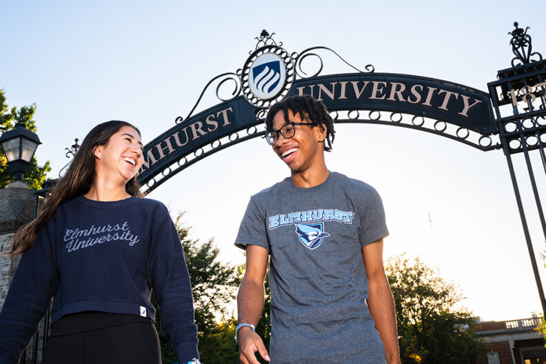 Students standing in front of the Gates of Knowledge