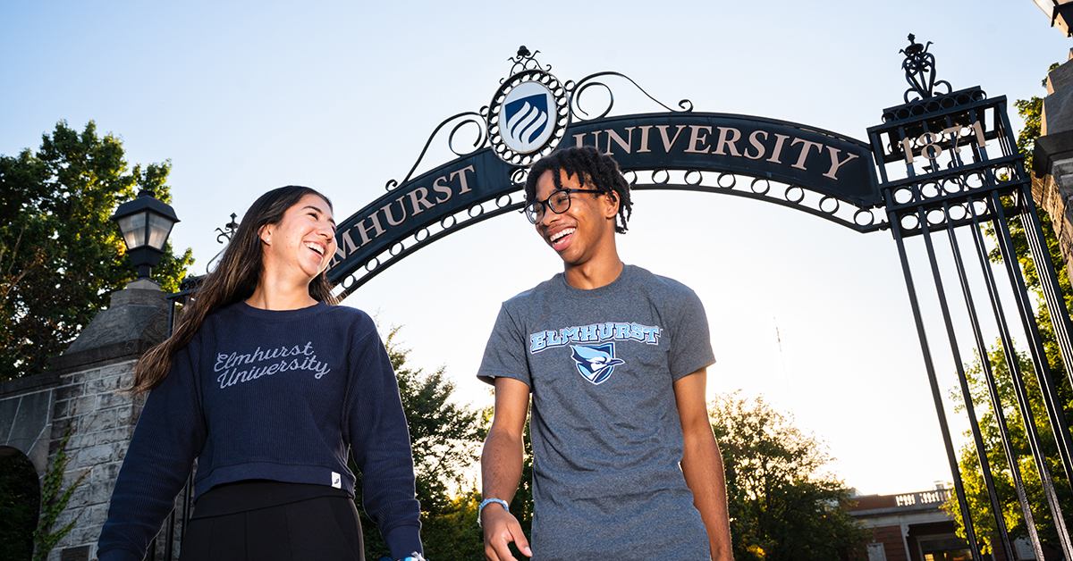 Students standing in front of the Gates of Knowledge