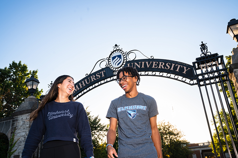 Students standing in front of the Gates of Knowledge