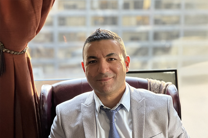 Man sitting in front of window