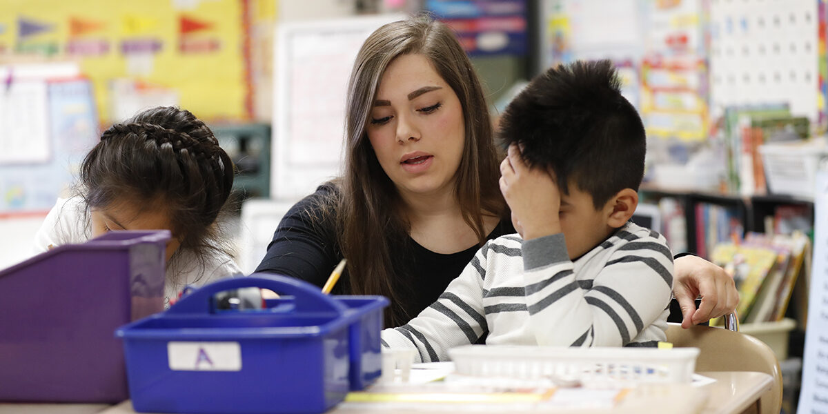 Student teacher with elementary children