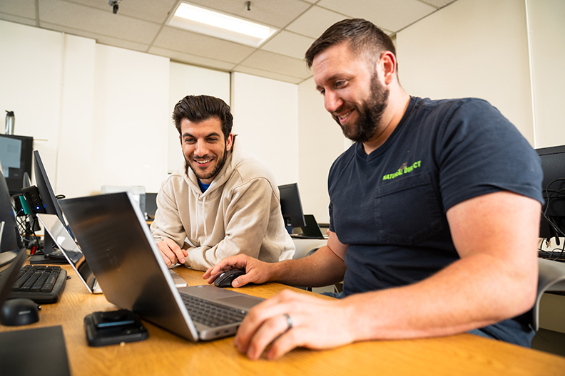 Students working on a laptop